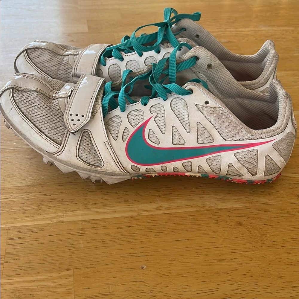 Nike pink, White and Blue cleats with Vibrant Laces